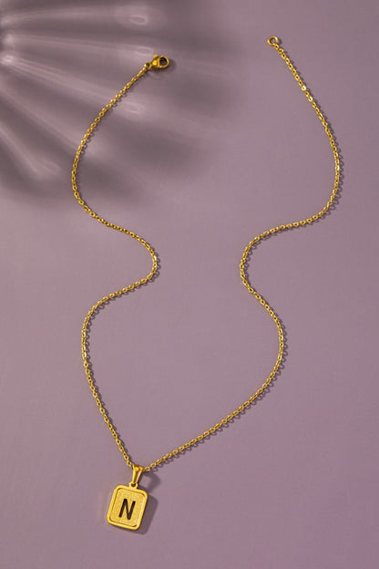 Brass diamond dust cut out initial necklace