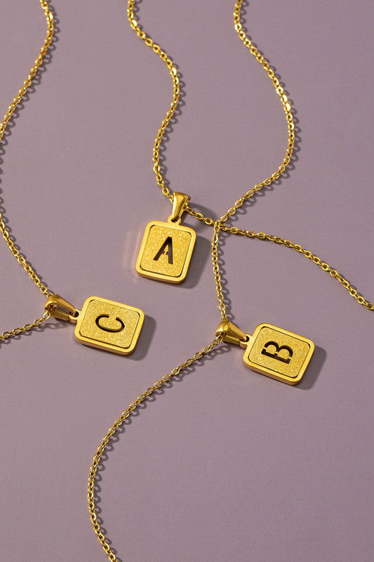 Brass diamond dust cut out initial necklace